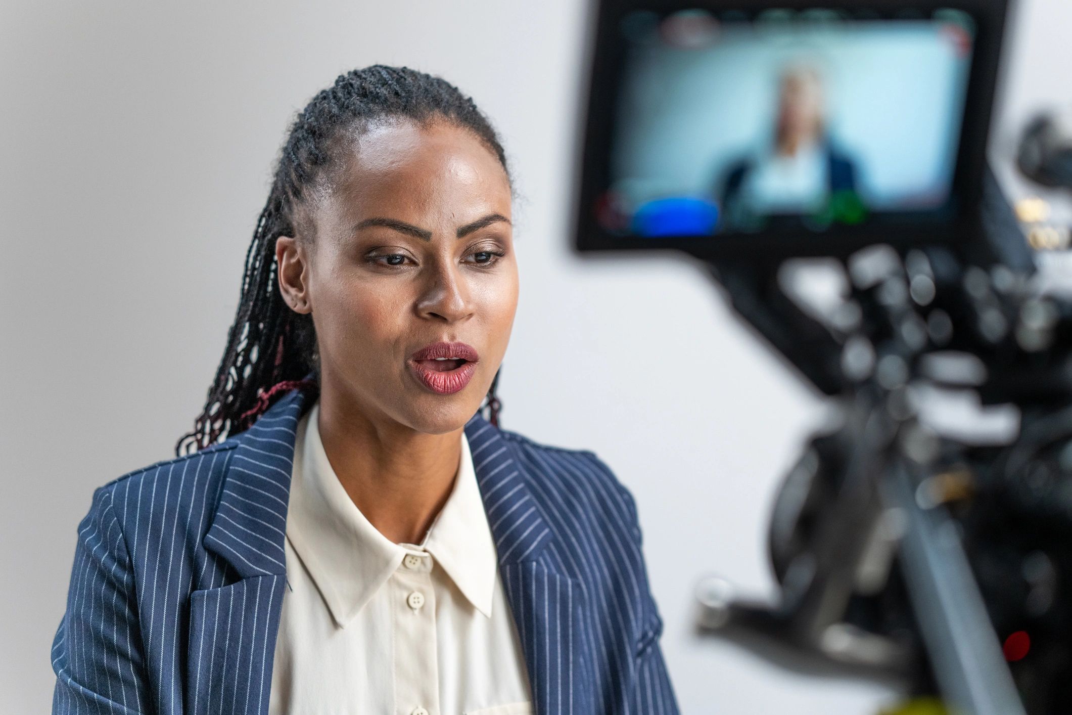 Behind-the-scenes portrait session with a camera