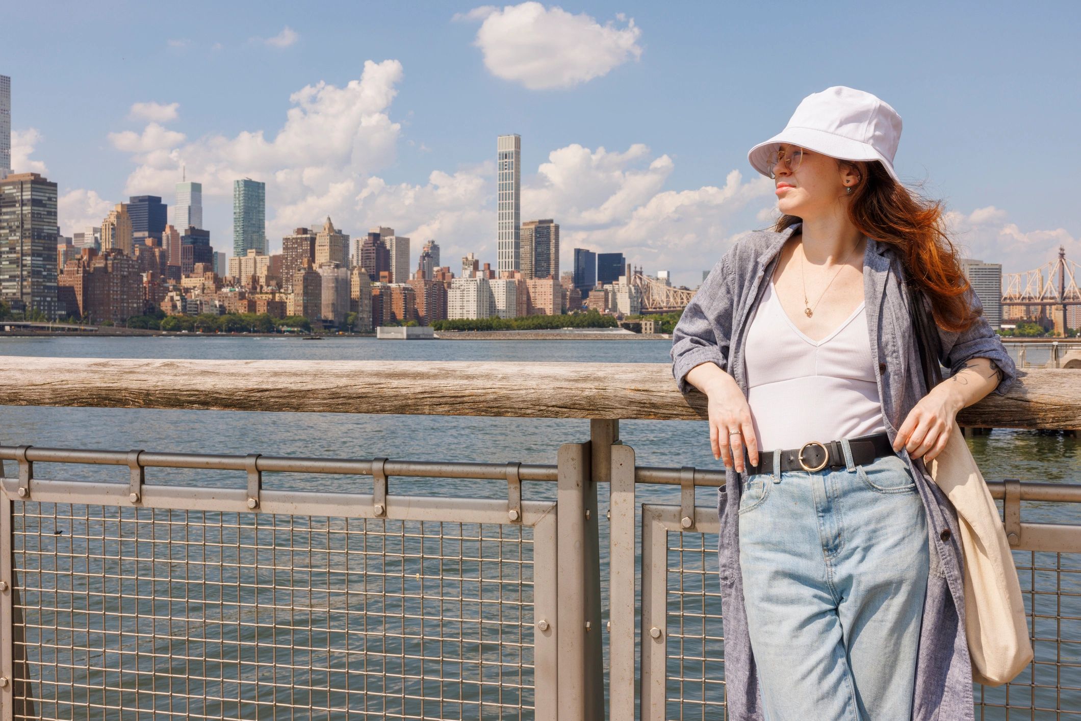 Smiling portrait on a NYC pier with skyline